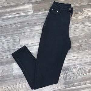 Distressed black skinny jeans